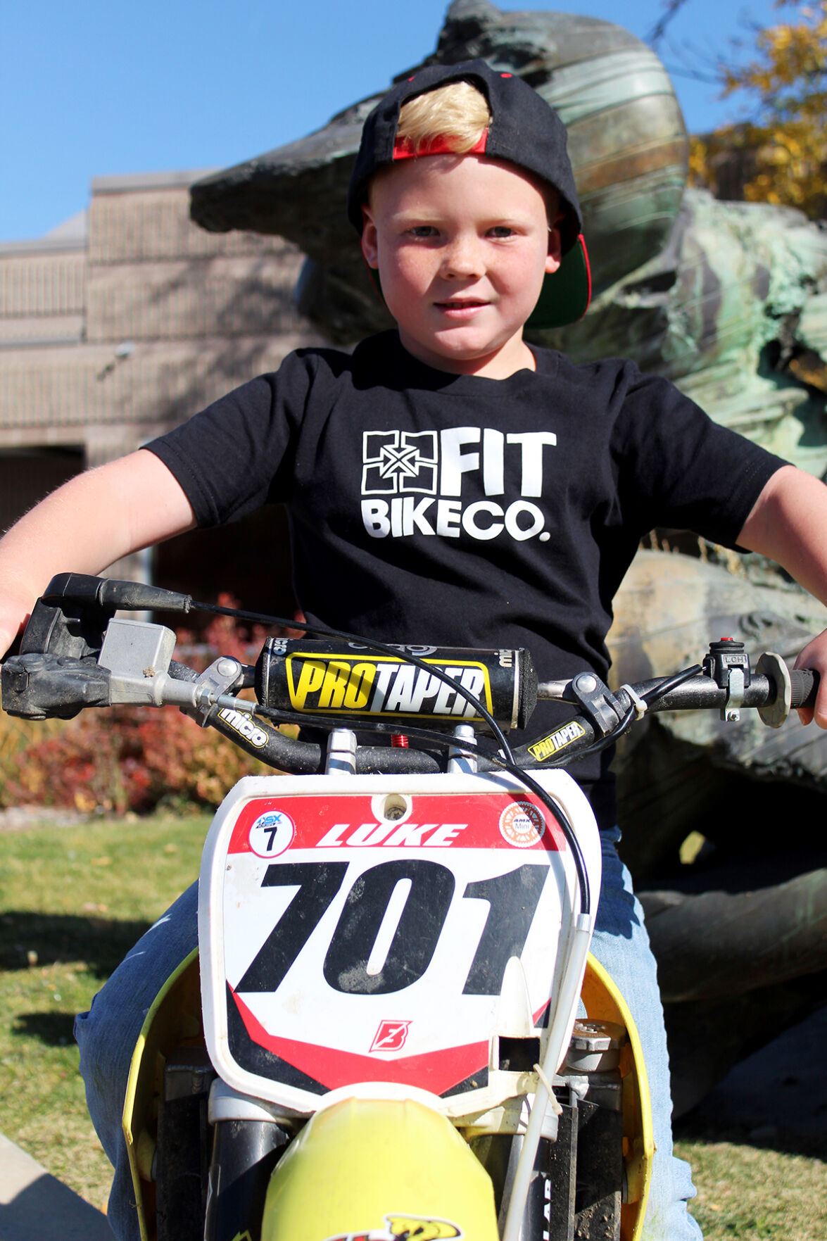 Noah sitting on bike